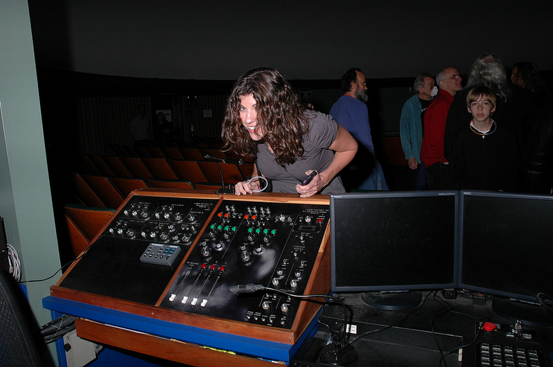 Debbie discovers the planetarium's Laser Fantasy control board.  Photo by Joseph Gutierrez.