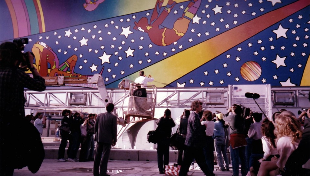 Peter Max signs the murals he created for the US Pavilion at Seville Expo 92. Photo courtesy James Ogul.