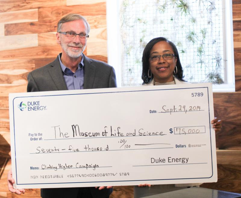 (From l to r) Barry Van Deman, president and CEO of the Museum of Life and Science accepted the generous gift of Duke Energy Foundation to support Hideaway Woods, an outdoor learning environment opening summer 2015 at the Museum of Life and Science. Gift presented on behalf of Duke Energy Foundation by Indira Everett, district Manager of Government and Community Relations for Duke Energy.  Photo courtesy of the Museum of Life and Science