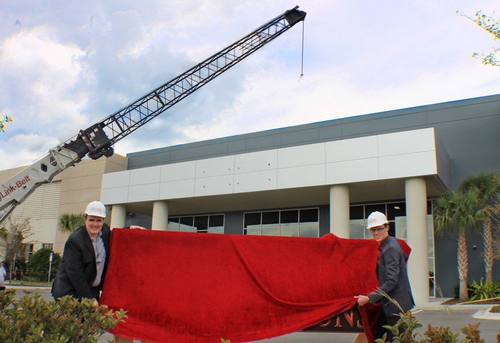 Michael Haimson and George Walker prepare to raise the sign on Dynamic Attractions’ new Development Center in Orlando. All images courtesy of Dynamic Attractions