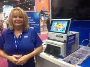 DNP's Suzanne Seagle stands next to the SnapLab+