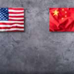 Usa flag and china flag on concrete background