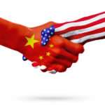 Flags of United States and China countries, overprinted handshake.
