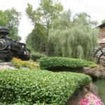 The Dollwood Express chugs past the old Grist Mill