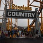 The Steel Curtain’s first riders line up. These people won a nationwide contest to ride before any other members of the public.