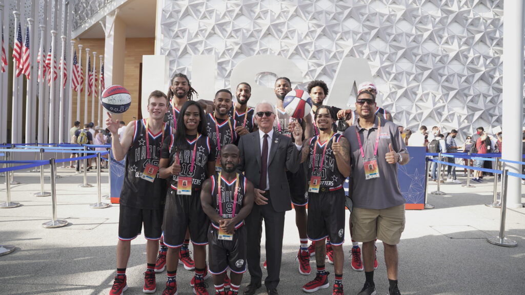 Commissioner General Robert Clark at the USA Pavilion, Expo 2020 Dubai, with Harlem Globetrotters