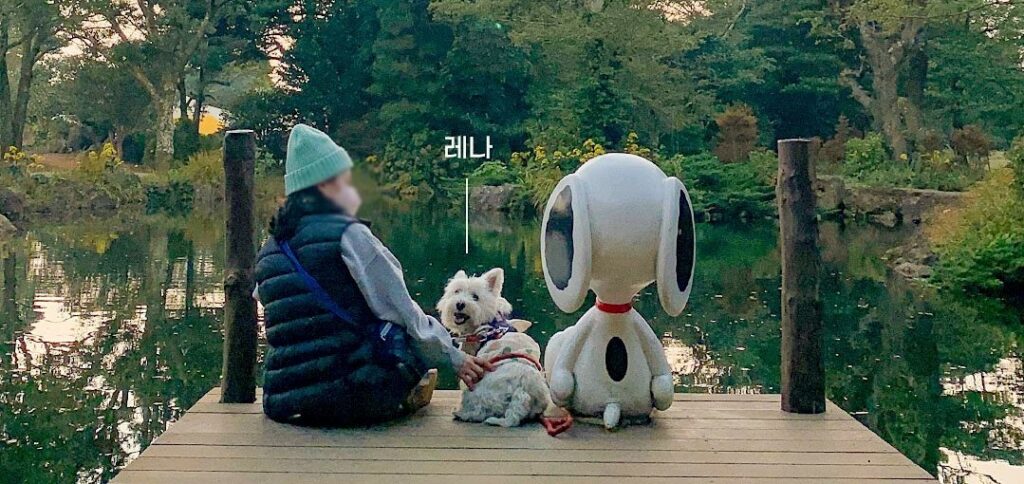 Snoopy and dog friend on pier at Snoopy Garden, Jeju, South Korea